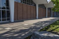 the sidewalk has been empty and is not cleared of grass in front of the building