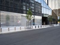 a black and silver street scene in a large city with glassy buildings and tall buildings