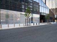 a black and silver street scene in a large city with glassy buildings and tall buildings