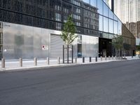 a black and silver street scene in a large city with glassy buildings and tall buildings