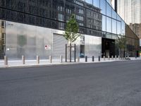 a black and silver street scene in a large city with glassy buildings and tall buildings