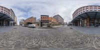 several fisheye lens photos of a busy city street with a few cars in the front of the street