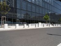 a building that is next to some benches in the street while someone is walking by