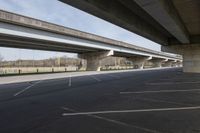 an image of a road with multiple overhead overpasses above it and on the ground