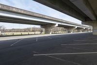 an image of a road with multiple overhead overpasses above it and on the ground