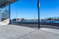 a large parking lot with a parking meter in the middle of it's corner