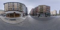 a 3d image of a busy street with buildings, and businesses on the corner of the road