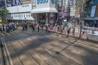 people are traveling by a street near the busy streets in tokyo with a single car