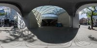 an outdoor restaurant is seen through the circular windows at a busy street in europe,