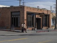 California's Asphalt Road: A Cityscape with Trees and Clouds