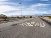 Asphalt Road Cutting Through California Desert