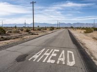 Asphalt Road Cutting Through California Desert