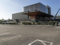 there is a black building with a large sign in front of it next to a blue building