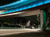 a very long exposure photo shows an underpass and lights from the night time to day