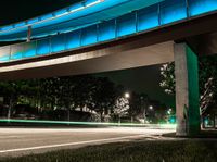 a very long exposure photo shows an underpass and lights from the night time to day