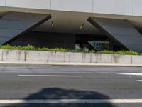 the large building has a reflection of itself on the glass exterior of it's building