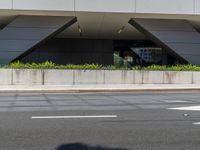 the large building has a reflection of itself on the glass exterior of it's building