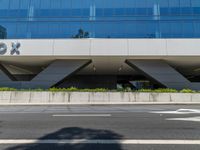 the large building has a reflection of itself on the glass exterior of it's building