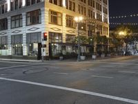 empty streets at night near tall building in the city of san francisco, california usa