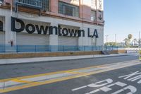 an empty street near a store that has some signs on it in front of a building