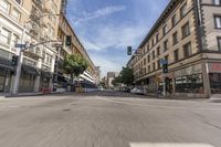 an empty city street with many cars driving on it, in a blurry photo