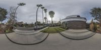 this is a fisheye image showing the same view as a photographer looks from a vehicle in front of the large building