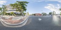 the street view with a convex lens of some type of building and street cars on it