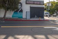 a building painted like obama with a business sign on it's side and a fire hydrant near the street