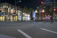 people are walking in the street while traffic goes by at night or in the city