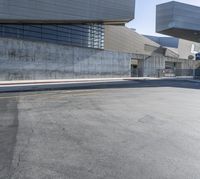 an empty, empty, concrete lot with no cars driving or parked on the side