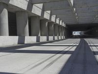 a tunnel that looks like it has some cars on it and is in between the buildings