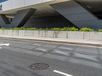 a city street with an awning in the corner near the curb on the road