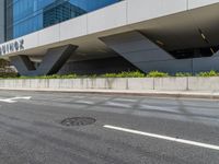 a city street with an awning in the corner near the curb on the road