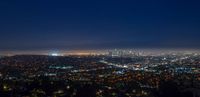 the los angeles skyline at night as seen from the griffith heights overlook photo via flick