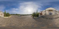 a 360 view of a very nice looking building in a city on a sunny day