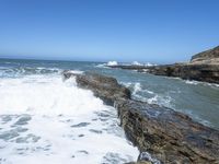 California Coastal Beach: Clear Sky and Sandy Shoreline