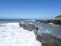 California Coastal Beach: Clear Sky and Sandy Shoreline