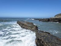 California Coastal Beach: Clear Sky and Sandy Shoreline