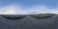 four curved roads passing by a very low horizon in the sky, in a 360 - turn