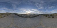 three different shots of the road and sky from a fisheye lens lensed view