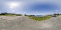 two shots show a car on the side of a mountain road in an image that looks like a fisheye lens