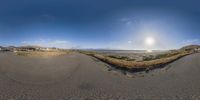 a panorama of a beach with houses and ocean in the background is featured in the new fisheye lens lens