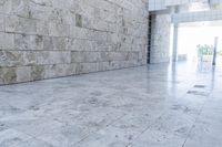 this concrete wall is an architectural feature in the interior of a building with a window at the bottom