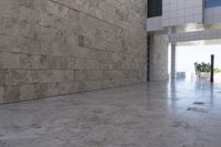 this concrete wall is an architectural feature in the interior of a building with a window at the bottom