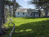 California countryside house with green lawn and open space