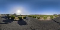 a 360 - angle view of the road in the countryside next to grass and hills