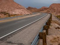 California Dawn: Clouds Over Asphalt Road