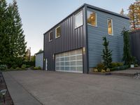 a house that has been built with two separate garage doors on top of the garage