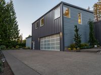 a house that has been built with two separate garage doors on top of the garage