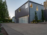 a house that has been built with two separate garage doors on top of the garage